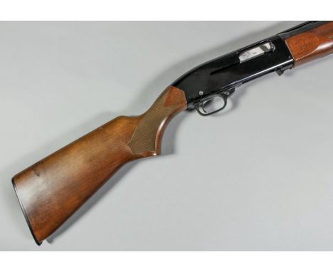 A 12 bore model 140 semi automatic shotgun by Winchester, Serial No. N952981, the 28ins blued steel barrel with raised top ri