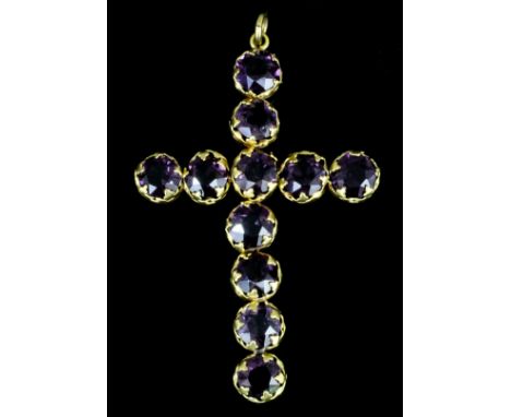 A late Victorian gold coloured metal mounted amethyst set cross pattern pendant, set with eleven circular cut amethysts, 80mm