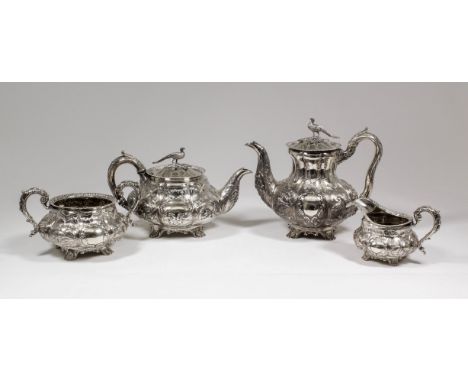 A good William IV silver four piece tea and coffee service, the squat bulbous lobed bodies embossed and chased with panels de