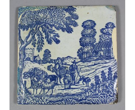 An 18th Century English Sadler & Green Delft tile with blue wood block printed design of peasants with goats and donkeys in a