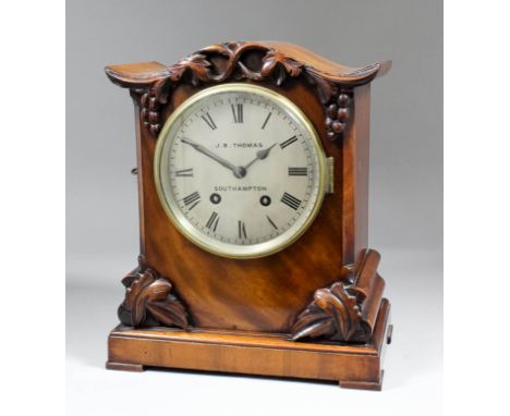 A Victorian mahogany cased mantel clock by J.B. Thomas of Southampton, the 5.5ins diameter silvered dial with Roman numerals 