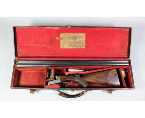 A good quality 12 bore side lock shotgun by Dan Fraser of Edinburgh, Serial No. 2443, the 30ins blued steel barrels with plai
