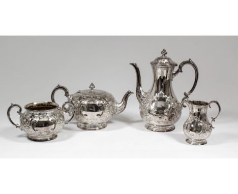 A Victorian silver Harlequin four piece tea and coffee service, the squat bulbous bodies embossed and chased with shaped leaf