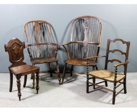 A 19th Century beechwood, ash and elm seated wheel back Windsor armchair with two tier stick back, on turned underframe (spli