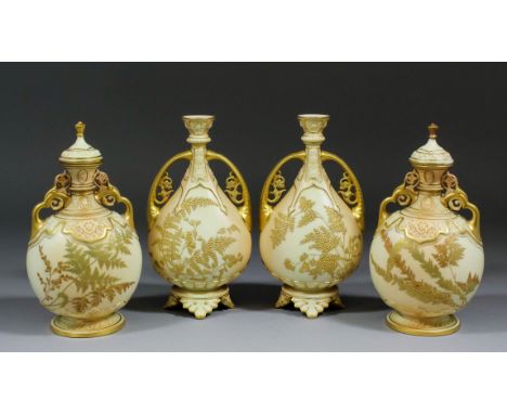 A pair of late 19th Century Royal Worcester "Blush Ivory" bone china two-handled vases and covers, the neck and feet moulded,