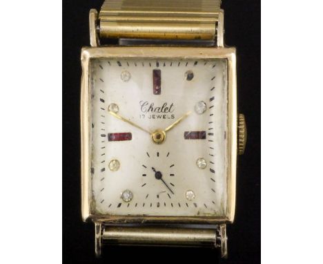 A 1950s gentleman's gold cased Chalet wristwatch, the champagne silvered face with semi-precious stone set numerals and subsi