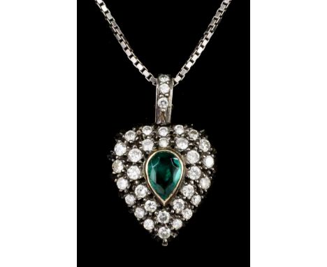 A late Victorian gold and silvery coloured metal mounted emerald and diamond set heart pattern pendant, the tear cut emerald 