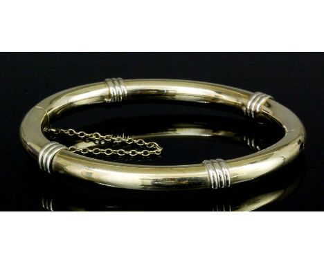 A modern 9ct gold stiff pattern bangle, quarter set with reeded decoration (gross weight 16.8 grammes)