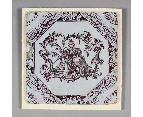 An 18th Century English Sadler & Green Delft tile with brown wood block printed design of a Turkish man with pipe set in a ro