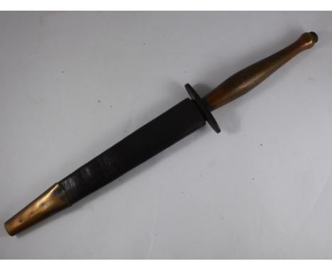 WWII FAIRBURN SYKES TYPE COMMANDO FIGHTING KNIFE, ONE PIECE BRASS CHEQUERED HANDLE, ORIGINAL BRASS MOUNTED LEATHER SCABBARD, 