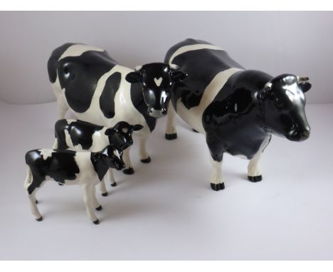 BESWICK FRESIAN BULL, COW AND 2 CALVES, all lots are sold as seen at the fall of the hammer, from a visual ispection these ap