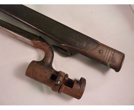 MILITARY BAYONET IN SCABBARD, A MARTINI HENRY BAYONET WITH CROWS FOOT 6/80, SPIKE APPROX. 21.5 INS.