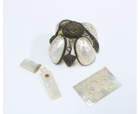 Mother pf pearl and gilt metal mounted needle case, 8cm, mother of pearl plaque with bird pattern and a brass and mother of p