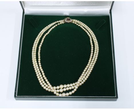 Vintage triple strand cultured pearl necklace with a 9ct gold garnet and seed pearl clasp, stamped 375 with hallmarks for Lon