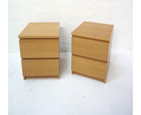 PAIR OF LIGHT OAK FILING CABINETS
each with two drawers, standing on a plinth base, 55cm high 