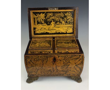 A good Regency Chinoiserie penwork Tea Caddy of sarcophagus form, the hinged cover depicting two figures seated by a tea tabl