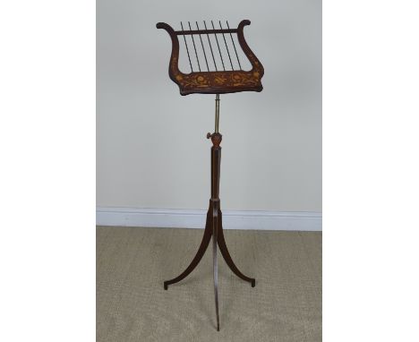 A mid 19th Century Music Stand with lyre form rest having floral and musical inlaid decoration with brass adjustable column, 