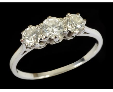 A Diamond three stone Ring claw-set graduated brilliant-cut stones in platinum, ring size M 1/2