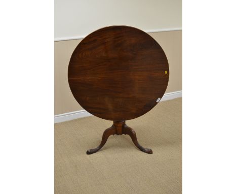 A George III mahogany Pillar Table with a circular top above a turned column on carved tripod legs, 3ft 1in D