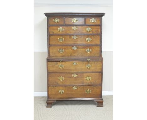 A George III mahogany Chest on Chest with dentil frieze above three short and six long drawers and brushing slide, the upper 