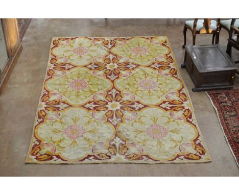 An antique Tapestry with six cream florettes on magenta ground 11ft 10in L x 6ft 4in W