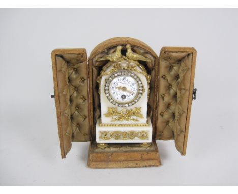 A French Mantel Clock having white enamel circular dial painted floral swags, inscribed 'Au Vase De Sevres', paste surround, 