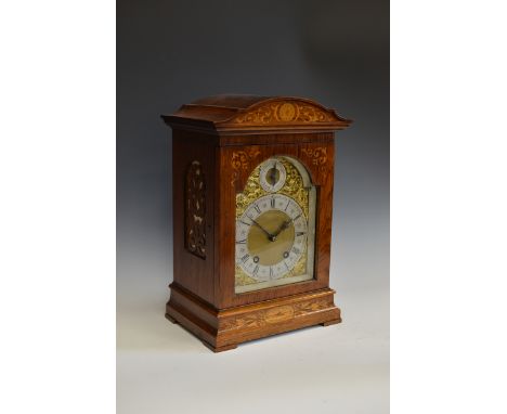 A German Mantel Clock with domed inlaid rosewood case, brass and silvered dial having 8-day striking movement by Lenzkirch, n