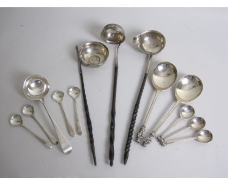 A pair of Edward VII silver Apostle Spoons, London 1904, a Georgian bottom marked Sauce Ladle, four Georgian Salt Shovels, th