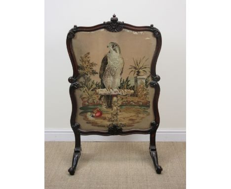 A 19th Century rosewood Firescreen with scroll carved frame containing a tapestry depicting a falcon on a T-Perch, 3ft 9in H