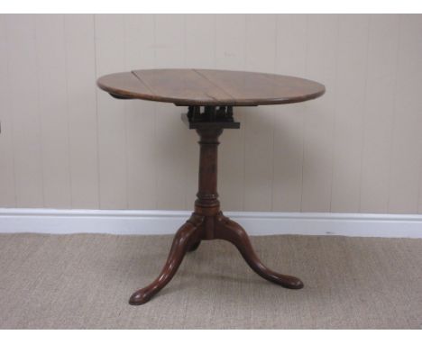 An 18th Century yew Pillar Table with circular top on bird-cage support, gun barrel turned column and tripod base, 2ft 7in