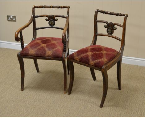 A set of six Regency mahogany Dining Chairs with bobbin turned top rails, brass boss to central splats, upholstered drop in s