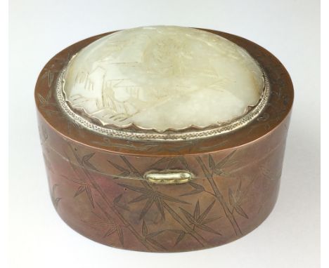 A jade mounted copper Box, The sides engraved with bamboo, chrysanthemum, iris and prunus, the hinged cover set with oval jad