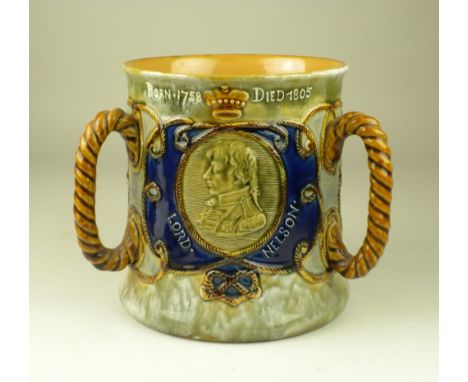 Nelson Interest: A Royal Doulton stoneware Commemorative Tyg, c. 1905,Decorated in green, blue and brown glazes, the sides wi