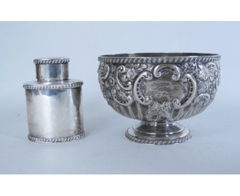 An Edward VII Rose Bowl floral and scroll embossed, London 1901, and a Victorian oval Tea Caddy with gadroon rims, London 190