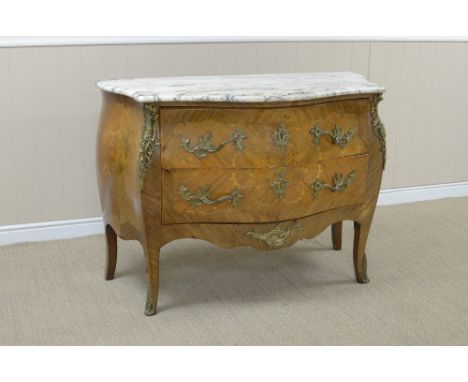 A Louis XV style kingwood Commode with marble top above shaped drawers having floral and scroll inlay, rococo gilt-metal moun