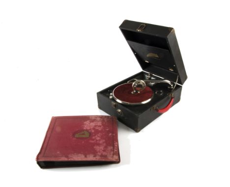 A Crescendo portable gramophone, made by Decca, in black case; and an album of records (2) 