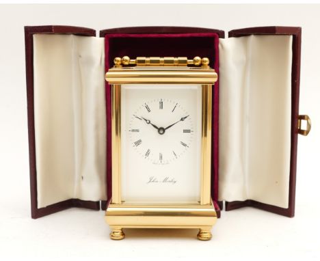 John Morley; A 20th Century brass cased carriage timepiece, with a white enamel dial, signed 'John Morley. Made in England', 