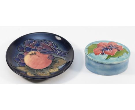 A Moorcroft dish, in the pattern, 'Finches and Fruit', date stamp is illegible, diameter 12cm, together with an oval trinket 