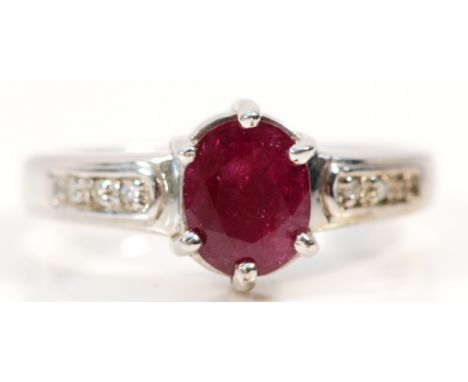 A 9ct white gold ruby solitaire ring with diamond set shoulders, N, 3.4g