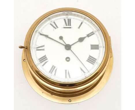 Coventry Astra, a 7" brass bulkhead clock, white enamel dial with black Roman numerals, centre seconds hand, the movement num