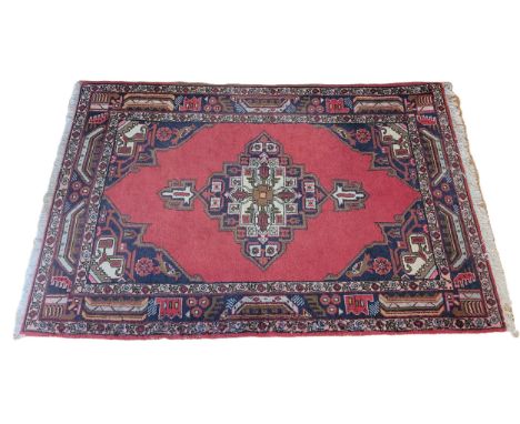 A Persian geometric rug, with red field, 160 x 108cm