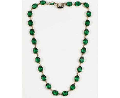 A late 19th century Sterling Silver and green paste Riviera necklace, composed of twenty seven 11 x 8mm stones, clasp stamped