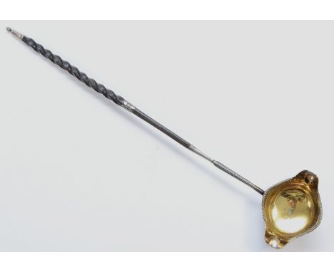 Of Masonic interest, a George III silver and whalebone double lip ladle, by Thomas Morley, London 1784, gilt bowl , bead bord