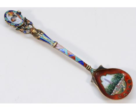 A German early 19th Century enamel and 800 standard silver gilt Egyptian revival spoon, with Moses basket holding a baby to t