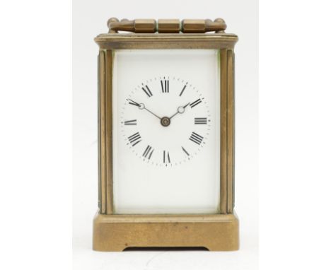 T. Martin & Co., London, a late 19th century brass striking carriage clock, the white enamel dial with Roman numerals, platfo