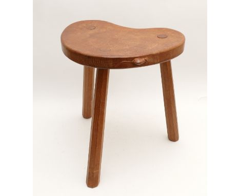 Robert "Mouseman" Thompson (1876-1955); An oak carved three-legged stool, with kidney shaped seat and mouse signature, H-46cm