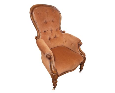 A Victorian mahogany nursing chair, having buttoned pale pink upholstery, raised on turned legs with ceramic castors, H90, W5