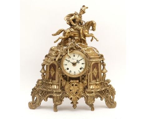 A 20th Century Italian Imperial gilt brass mantel clock, surmounted by a rider on horseback, with an enamel dial featuring Ro