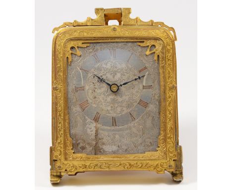 A gilt brass strut clock, in the style of Thomas Cole, late 19th/early 20th century, the rectangular floral engraved silvered