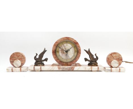 A 20th Century three piece veined marble and alabaster garniture, comprising of a mantel clock, with a bronzed chapter ring f
